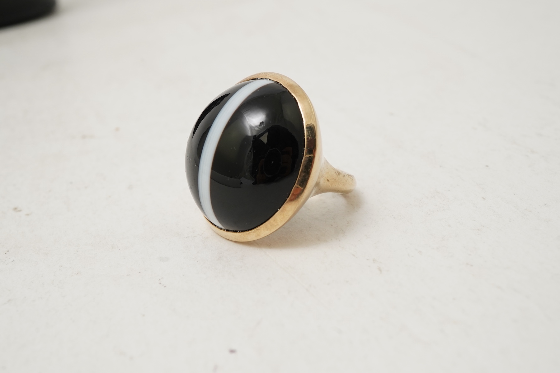 An onyx dress ring and pair of earrings